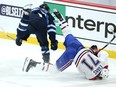 Winnipeg Jets centre Mark Scheifele (left) level Montreal Canadiens centre Jake Evans after his empty-net goal during Game 1 of the North Division final in Winnipeg on Wed., June 2, 2021. KEVIN KING/Winnipeg Sun/Postmedia Network