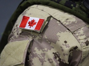 A Canadian flag patch is shown on a soldier's shoulder in Trenton, Ont., on Thursday, Oct. 16, 2014.