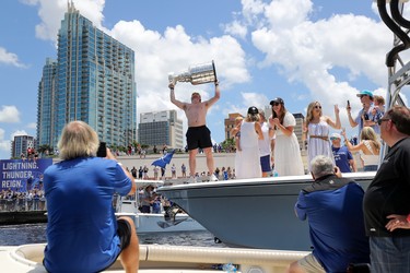 Blake Coleman of the Tampa Bay Lightning raises the Stanley Cup during the boat parade to celebrate the Tampa Bay Lightning winning the Stanley Cup July 12, 2021 in Tampa, Florida. (Photo by Mike Carlson/Getty Images)