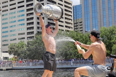Ondrej Palat  of the Tampa Bay Lightning is sprayed with champagne during the boat parade to celebrate the Tampa Bay Lightning winning the Stanley Cup July 12, 2021 in Tampa, Florida. (Photo by Mike Carlson/Getty Images)