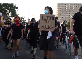 Activists march through the Lawndale neighborhood calling for the defunding of police on July 24, 2020 in Chicago.