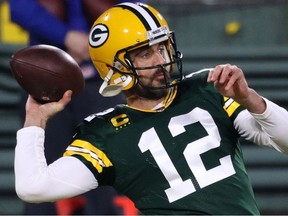 Quarterback Aaron Rodgers #12 of the Green Bay Packers warms up prior to the game against the Carolina Panthers at Lambeau Field on December 19, 2020 in Green Bay, Wisconsin.