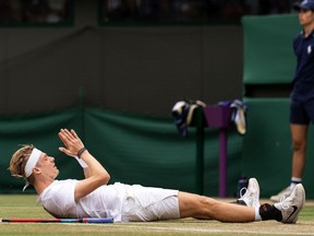 Denis Shapovalov of Canada celebrates after winning match point during his men's Singles Quarter Final match against Karen Khachanov of Russia on Day Nine of The Championships - Wimbledon 2021 at All England Lawn Tennis and Croquet Club on July 07, 2021 in London, England.