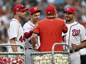 Only a couple of weeks ago, (from left) Max Scherzer, Trea Turner and Kyle Schwarber, here talking to coach Kevin Long, were representing the Nationals at the all-star game. Today, following a whirlwind couple of days leading up to the MLB trade deadline, they are all on new teams..