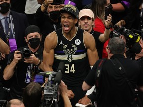 Giannis Antetokounmpo #34 of the Milwaukee Bucks celebrates defeating the Phoenix Suns in Game Six to win the 2021 NBA Finals at Fiserv Forum on July 20, 2021 in Milwaukee, Wisconsin.