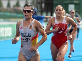 Miriam Casillas Garcia of Team Spain and Amelie Kretz of Team Canada compete during the individual triathlon on Day 4 of the Tokyo 2020 Olympic Games at Odaiba Marine Park on July 27, 2021 in Tokyo, Japan.