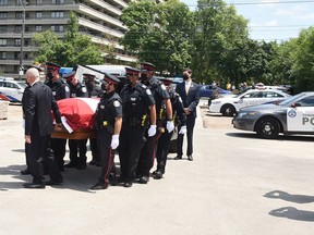 Officers escorted fallen officer Detective Constable Jeffrey Northrup to the funeral home