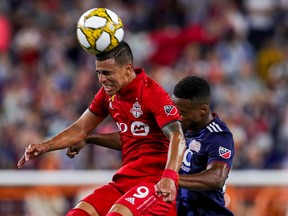 Toronto FC midfielder Erickson Gallardo heads the ball during a match against the New England Revolution.