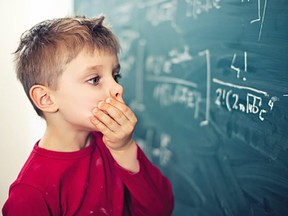 Illustration: Boy overwhelmed by the math formula in front of him.