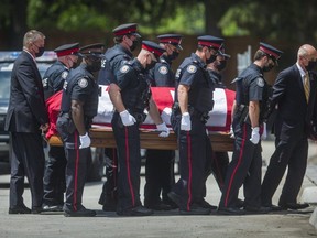 Toronto Police carry Const. Jeffrey Northrup's casket  into the Kane-Jerrett Funeral Home in Thornhill on July 4, 2021.