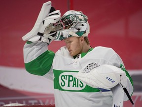 Goalie Frederik Andersen, reseting his mask. has been signed by the Carolina Hurricanes.