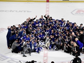 The Tampa Bay Lightning poses for the traditional photo with the Stanley Cup after defeating the Montreal Canadiens 1-0 in Game 5 on Wednesday at Amalie Arena.