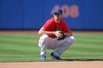 New York Mets starting pitcher Jacob deGrom fields balls at shortstop during batting practice before a game prior to the all-star break. He would go on the IL with right forearm tightness.