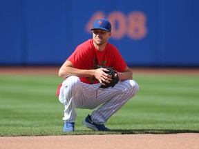 New York Mets starting pitcher Jacob deGrom fields balls at shortstop during batting practice before a game prior to the all-star break. He would go on the IL with right forearm tightness.