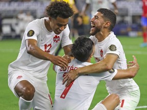 Canada midfielder Stephen Eustaquio (7) celebrates with teammates after scoring a goal against Costa Rica during the second half of a CONCACAF Gold Cup quarterfinal soccer match at AT&T Stadium on July 25, 2021.