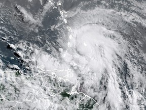 This RAMMB National Oceanic and Atmospheric Administration(NOAA) satellite image taken on July 4, 2021 at 11:40 UTC shows  shows hurricane Elsa moving towards the southwestern coast of Haiti, headed toward Jamaica and eastern Cuba in the eastern Caribbean.