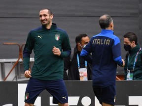 Italy's defender Giorgio Chiellini, left, takes part in a training session at The Hive Stadium in London on Monday.