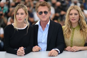 U.S. actor and director Sean Penn, centre, poses with actress Dylan Penn and actress Katheryn Winnick during a photocall for the film “Flag Day” at the 74th edition of the Cannes Film Festival in Cannes, southern France, on July 11, 2021.