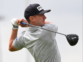 Canada's Mackenzie Hughes watches his drive from the ninth tee during his first round of the 149th British Open  at Royal St George's.