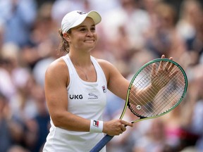 Australia's Ashleigh Barty celebrates her victory against Germany's Angelique Kerber during their Wimbledon semifinal match at The All England Tennis Club in London, England, Thursday, July 8, 2021.