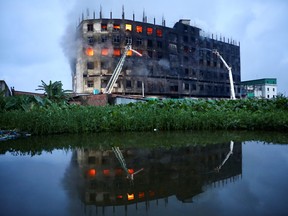 Flames rise the morning after a fire broke out at a factory named Hashem Foods Ltd. in Rupganj of Narayanganj district, on the outskirts of Dhaka, Bangladesh, July 9, 2021.