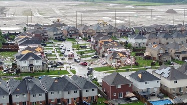 An aerial view shows damage to buildings in a suburb in the aftermath of a tornado in Barrie on Thursday, July 15, 2021. EDWARD LOVELESS VIA REUTERS