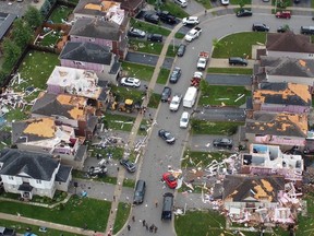 An aerial view shows damage to buildings in a suburb in the aftermath of a tornado in Barrie on Thursday, July 15, 2021. FILE PHOTO