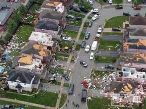 An aerial view shows damage to buildings in a suburb in the aftermath of a tornado in Barrie on Thursday, July 15, 2021.