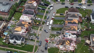 An aerial view shows damage to buildings in a suburb in the aftermath of a tornado in Barrie on Thursday, July 15, 2021.