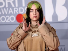Billie Eilish poses as she arrives for the Brit Awards at the O2 Arena in London February 18, 2020.