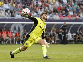 Toronto FC goalkeeper Alex Bono slings the ball back into play against the Chicago Fire on Saturday night at Soldier Field.