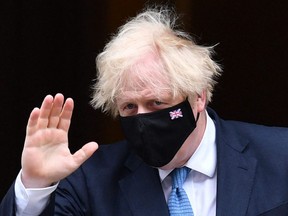 Britain's Prime Minister Boris Johnson leaves No. 10 Downing Street in central London, July 14, 2021.