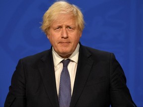 Britain's Prime Minister Boris Johnson gives an update on relaxing restrictions imposed on the country during the COVID-19 pandemic at a virtual press conference inside the Downing Street Briefing Room in central London on July 12, 2021.