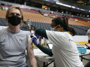 Geoff Emmett gets his vaccination inside Scotiabank Arena on Sunday, June 27, 2021.