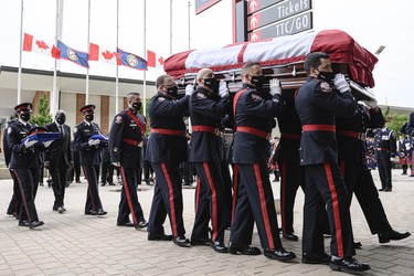 The casket of late Toronto Police Const. Jeffrey Northrup is carried by pallbearers into BMO stadium in Toronto where a funeral service is being held on Monday, July 12, 2021.