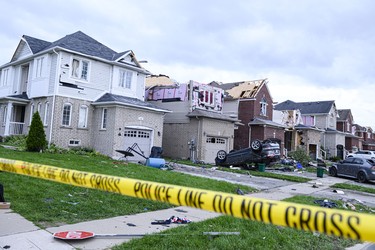 Damage left after a tornado touched down in a neighbourhood in Barrie, Ont., on Thursday, July 15, 2021. THE CANADIAN PRESS/Christopher Katsarov