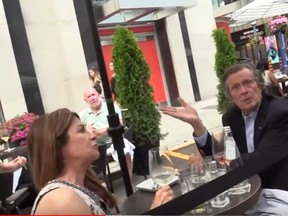 Toronto Mayor John Tory was having dinner on a patio with his wife, Barbara Hackett, when activists saying they were with The Peoples Media  confronted the mayor about his COVID policies.