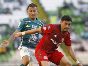 TFC midfielder Mark Delgado, right, was forced to drop back to the fullback position on Wednesday when Auro went down with an injury. 
The Associated Press