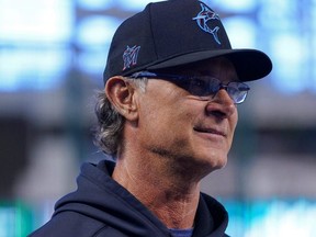 Marlins manager Don Mattingly walks on the field prior to a game against the Padres at loanDepot park in Miami, July 23, 2021.