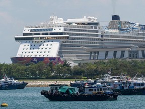 A World Dream, Dream Cruises' ship is docked at Marina Cruise Centre in Singapore on Oct. 27, 2020 following its arrival ahead of a travel promotion Singapore's cruises to nowhere, during the COVID-19 pandemic.