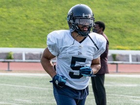 Veteran running back John White, running off  the field at the U. of Guelph during training camp on Wednesday, gives the Argos experience and versatility out of the backfield.