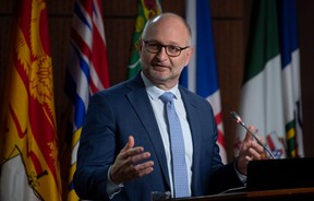 Justice Minister David Lametti responds to a question during a news conference in Ottawa on Friday, May 7, 2021.