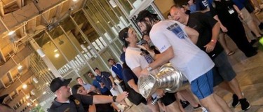 The Stanley Cup appears warped during Tampa Bay Lightning celebrations on Monday, July 12, 2021.