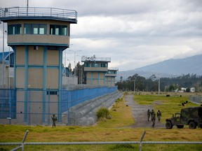 Soldiers stand guard outside the Sierra Centro Norte prison in Latacunga, Ecuador, on July 22, 2021.