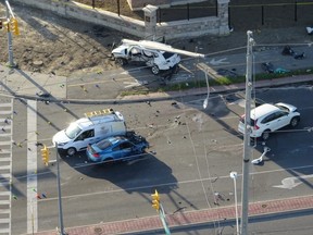 Brady Robertson's blue Infiniti G35 is seen here after he ran a red light at Torbram Rd. and Countryside Dr., in Brampton, and broadsided a white Volkswagen Atlas (top centre with a light standard on its roof) killing its occupants -- Karolina Ciasullo, 36, and her daughters Klara, 6, Lilianna, 3 and Mila, 1 -- on June 18, 2020.