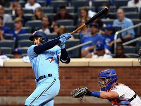Toronto Blue Jays centr- fielder George Springer hits a solo home run against the New York Mets during the third inning at Citi Field in New York City, July 24, 2021.