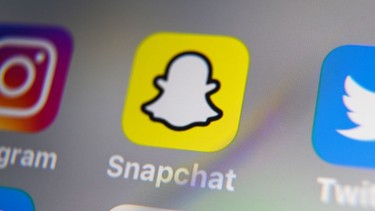 A picture taken on October 1, 2019 in Lille shows the logo of mobile app Snapchat displayed on a tablet.