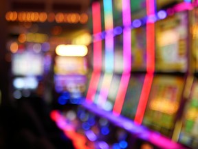 Slot machines glow in a casino.
