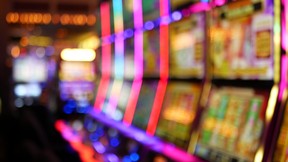Slot machines glow in a casino.