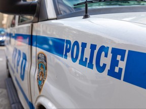 Police Vehicle in NYC, USA. Blue Color on the White Car.